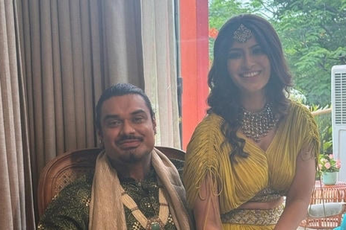 Varalaxmi Sarathkumar radiates joy at her first pre-wedding celebration, looking stunning in a green outfit. Mehendi photos capture her alongside Nicholai Sachdev, showcasing her glowing happiness.